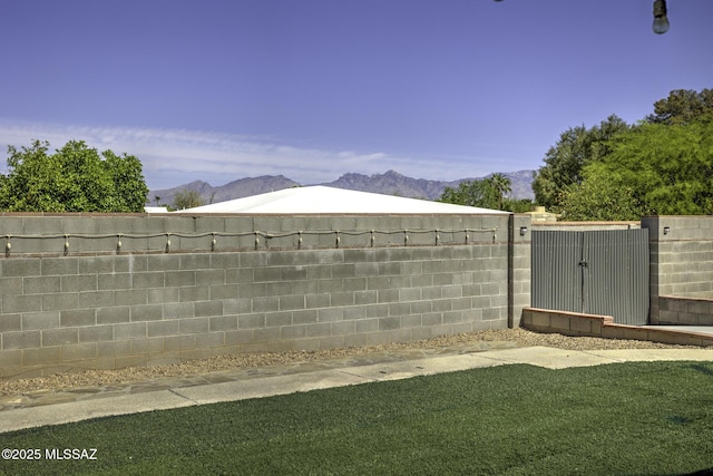 7217 E Fayette St, Tucson, AZ 85730 - fenced yard with a mountain view and a gate