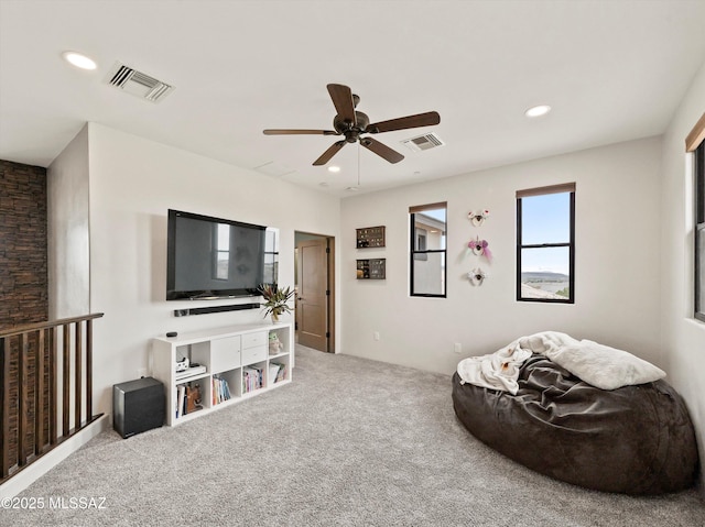 carpeted living room with visible vents, a ceiling fan, and recessed lighting