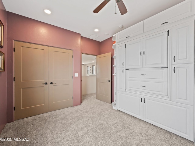 unfurnished bedroom featuring recessed lighting, ceiling fan, and carpet floors