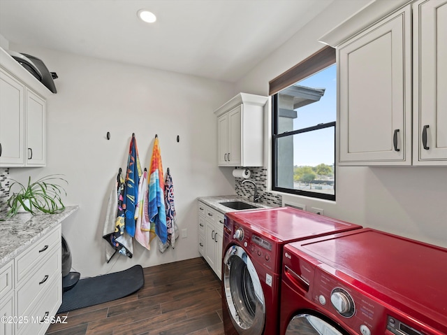 clothes washing area featuring independent washer and dryer, recessed lighting, a sink, dark wood-style floors, and cabinet space