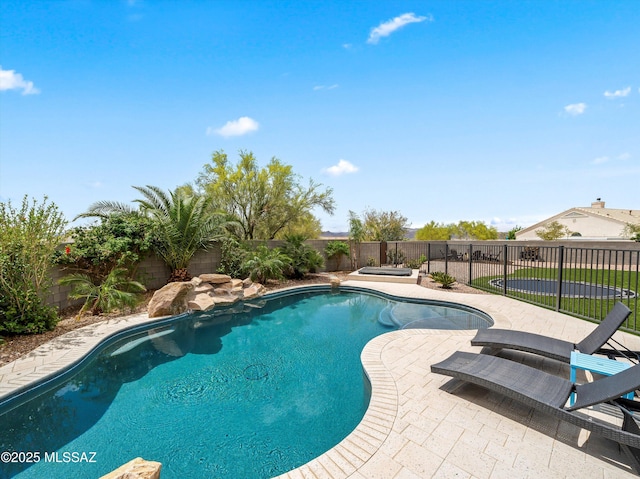 view of pool featuring a fenced backyard, a fenced in pool, and a patio