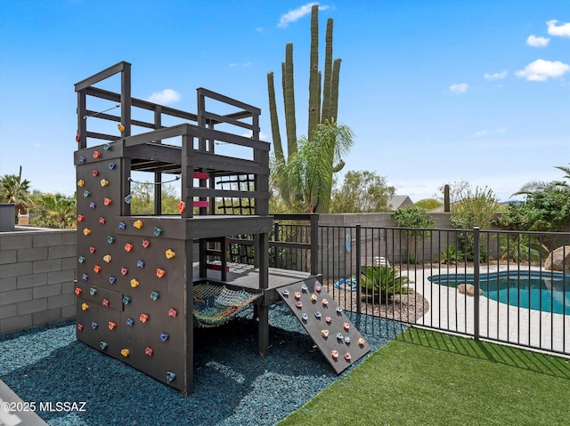 view of patio featuring fence and a fenced in pool