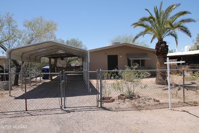 2665 N Leah Pl, Tucson, AZ 85705 - manufactured / mobile home featuring fence, a gate, and a carport