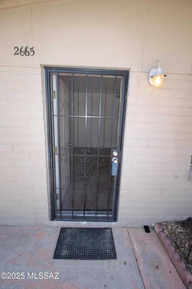 2665 N Leah Pl, Tucson, AZ 85705 - view of exterior entry featuring brick siding