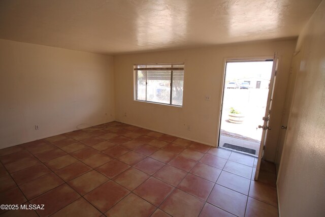 2665 N Leah Pl, Tucson, AZ 85705 - spare room with light tile patterned floors