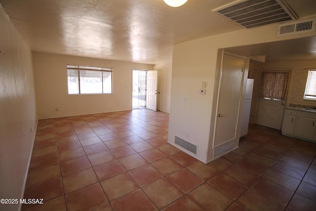 2665 N Leah Pl, Tucson, AZ 85705 - spare room featuring light tile patterned floors