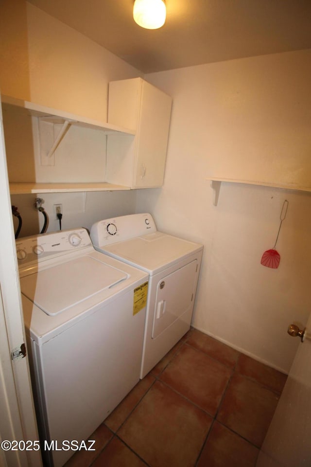 2665 N Leah Pl, Tucson, AZ 85705 - laundry area with washer and dryer, light tile patterned floors, cabinet space, and baseboards