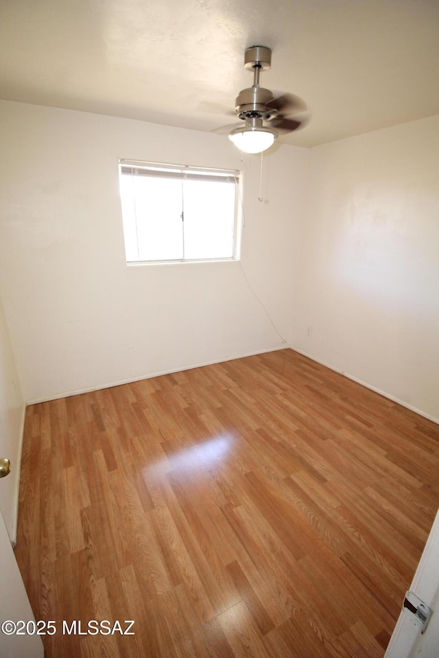 2665 N Leah Pl, Tucson, AZ 85705 - empty room with light wood-style floors and ceiling fan