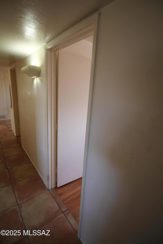 2665 N Leah Pl, Tucson, AZ 85705 - corridor featuring light tile patterned floors
