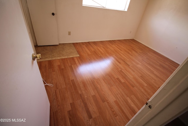 2665 N Leah Pl, Tucson, AZ 85705 - empty room with light wood-type flooring and baseboards