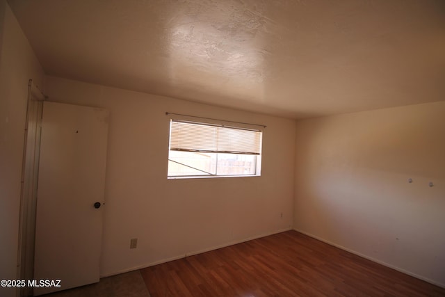 2665 N Leah Pl, Tucson, AZ 85705 - unfurnished room featuring wood finished floors and baseboards