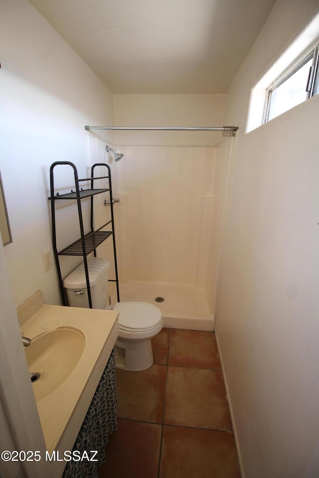 2665 N Leah Pl, Tucson, AZ 85705 - bathroom featuring toilet, a shower, tile patterned flooring, and vanity