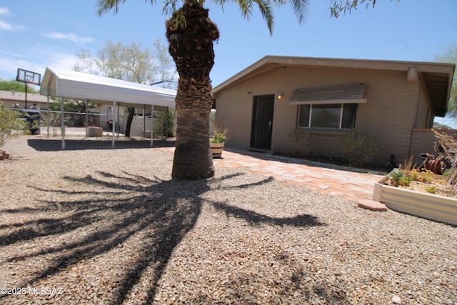 2665 N Leah Pl, Tucson, AZ 85705 - rear view of house featuring a detached carport