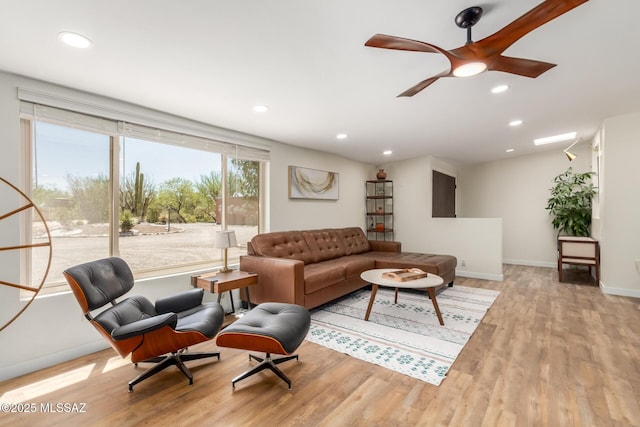 6821 N Cassim Pl, Tucson, AZ 85704 - living area with wood finished floors, ceiling fan, recessed lighting, and baseboards