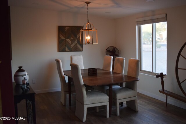 6821 N Cassim Pl, Tucson, AZ 85704 - dining space featuring dark wood-type flooring, baseboards, and a chandelier