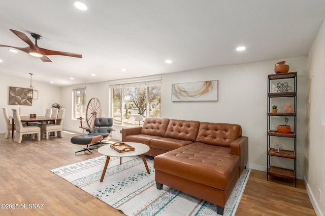 6821 N Cassim Pl, Tucson, AZ 85704 - living room with wood finished floors, recessed lighting, ceiling fan, and baseboards