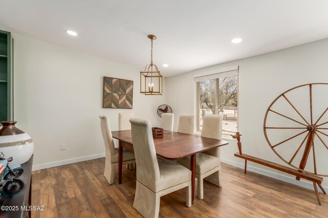 6821 N Cassim Pl, Tucson, AZ 85704 - dining space featuring wood finished floors, recessed lighting, a chandelier, and baseboards