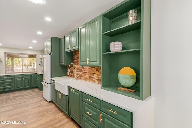 6821 N Cassim Pl, Tucson, AZ 85704 - kitchen with a sink, open shelves, decorative backsplash, light wood-type flooring, and recessed lighting