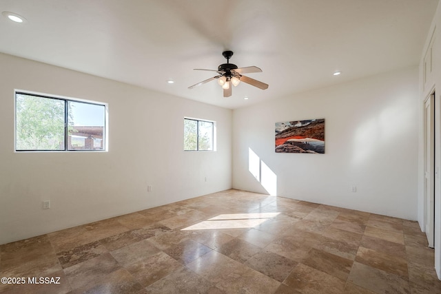 17300 S Camino Cartagena, Sahuarita, AZ 85629 - empty room with recessed lighting, ceiling fan, and stone finish flooring