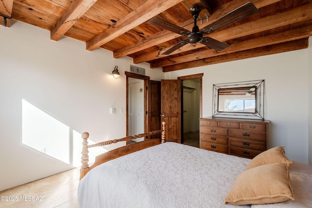 17300 S Camino Cartagena, Sahuarita, AZ 85629 - bedroom with visible vents, beam ceiling, a walk in closet, wood ceiling, and light tile patterned floors