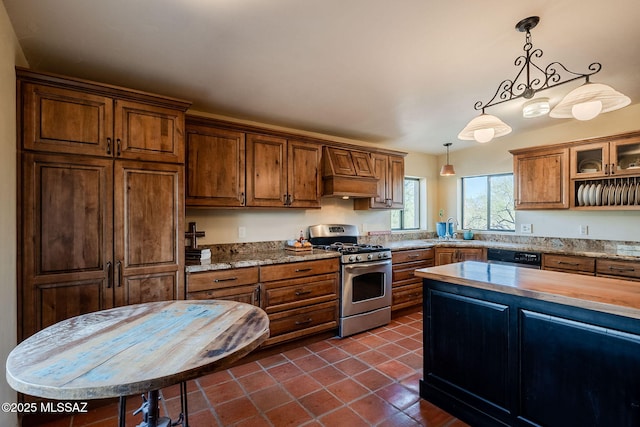 17300 S Camino Cartagena, Sahuarita, AZ 85629 - kitchen featuring gas range, hanging light fixtures, brown cabinets, a sink, and dishwashing machine