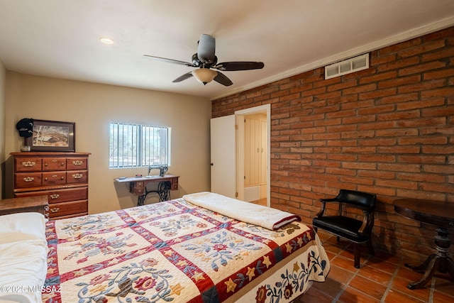 17300 S Camino Cartagena, Sahuarita, AZ 85629 - bedroom with dark tile patterned floors, brick wall, visible vents, and ceiling fan