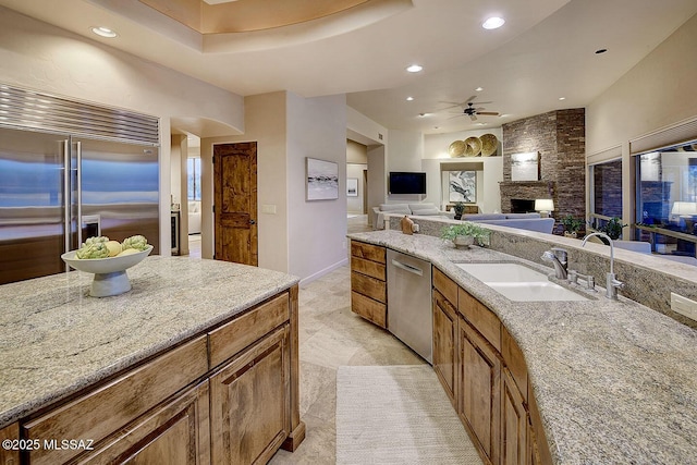 bathroom featuring recessed lighting, a ceiling fan, vanity, and a fireplace