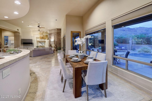 dining space featuring recessed lighting, a ceiling fan, and baseboards