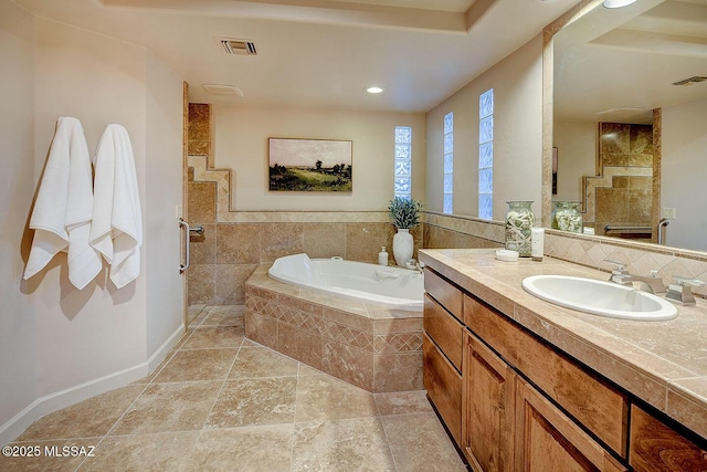 full bath featuring a tile shower, a bath, visible vents, and vanity