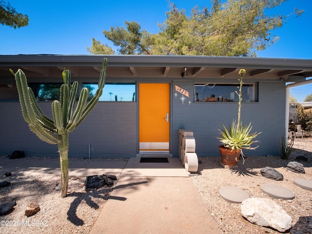 entrance to property with concrete block siding
