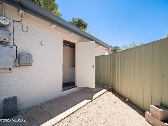 view of exterior entry with fence