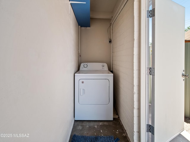 clothes washing area with laundry area and washer / clothes dryer