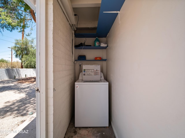laundry area featuring laundry area and washer / dryer
