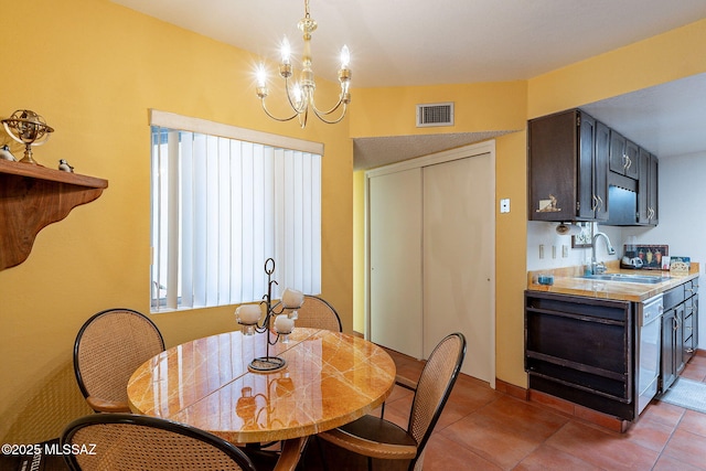 dining space featuring a notable chandelier, light tile patterned flooring, visible vents, and plenty of natural light