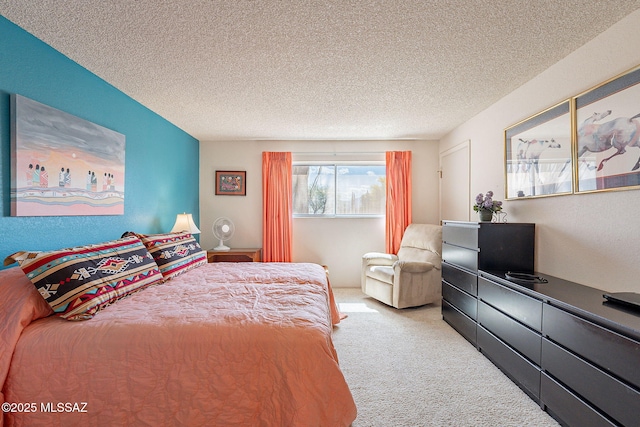 bedroom featuring carpet floors and a textured ceiling