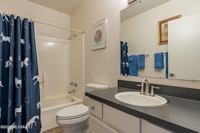 bathroom with shower / bath combo, vanity, and toilet