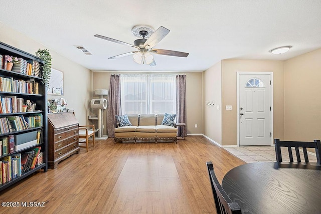 3969 W Pine Creek Way, Tucson, AZ 85745 - interior space featuring visible vents, a ceiling fan, baseboards, and light wood-style flooring