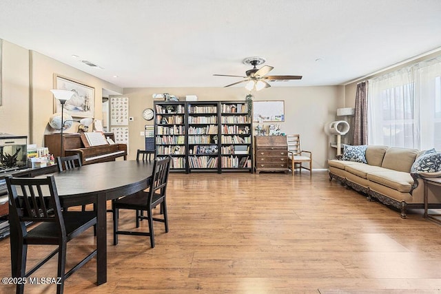 3969 W Pine Creek Way, Tucson, AZ 85745 - dining space featuring wood finished floors, visible vents, and ceiling fan