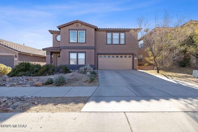 3969 W Pine Creek Way, Tucson, AZ 85745 - view of front facade featuring a garage, a tiled roof, driveway, and stucco siding