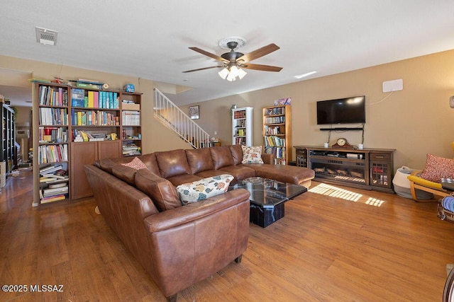 3969 W Pine Creek Way, Tucson, AZ 85745 - living area with stairway, visible vents, a ceiling fan, and wood finished floors
