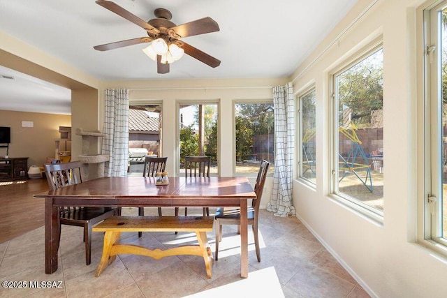 3969 W Pine Creek Way, Tucson, AZ 85745 - dining room featuring a wealth of natural light, a ceiling fan, baseboards, and visible vents