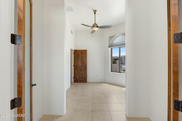11028 N Pusch Ridge View Pl, Oro Valley, AZ 85737 - spare room with a ceiling fan and light tile patterned flooring