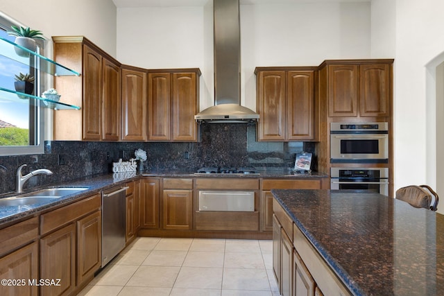 11028 N Pusch Ridge View Pl, Oro Valley, AZ 85737 - kitchen with wall chimney range hood, appliances with stainless steel finishes, a warming drawer, decorative backsplash, and dark stone countertops