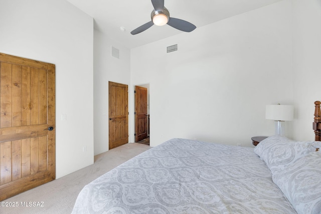 11028 N Pusch Ridge View Pl, Oro Valley, AZ 85737 - bedroom with light carpet, a high ceiling, and a ceiling fan