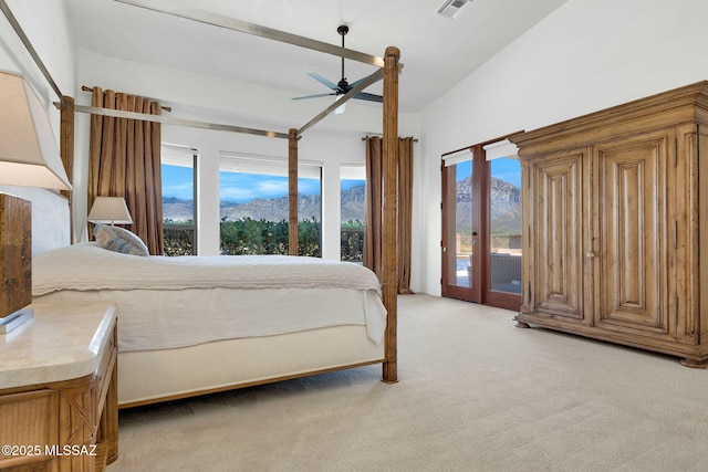 11028 N Pusch Ridge View Pl, Oro Valley, AZ 85737 - bedroom with access to outside, light carpet, multiple windows, and a mountain view