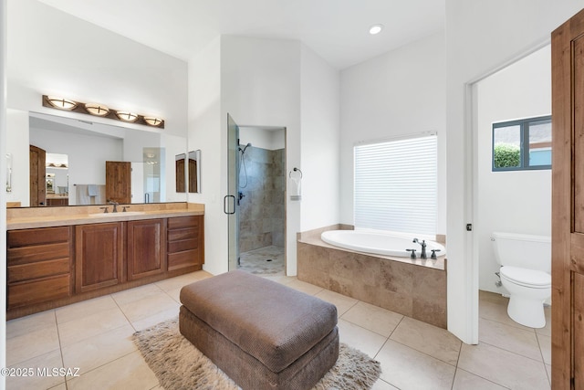 11028 N Pusch Ridge View Pl, Oro Valley, AZ 85737 - bathroom with vanity, a garden tub, tile patterned floors, and a stall shower