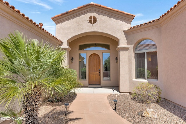 11028 N Pusch Ridge View Pl, Oro Valley, AZ 85737 - doorway to property featuring stucco siding and a tiled roof