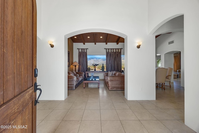 11028 N Pusch Ridge View Pl, Oro Valley, AZ 85737 - foyer with light tile patterned flooring, wooden ceiling with exposed beams, and a high ceiling