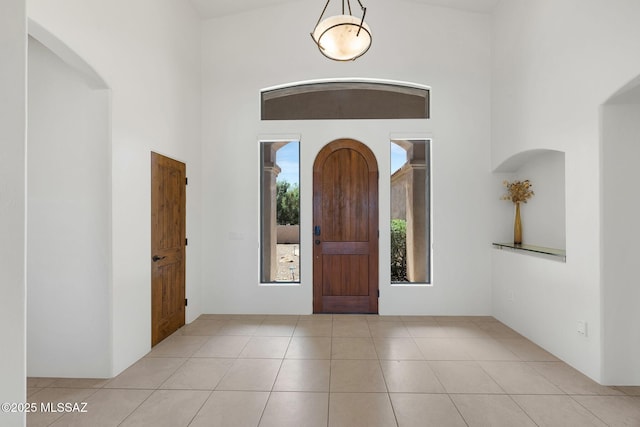 11028 N Pusch Ridge View Pl, Oro Valley, AZ 85737 - tiled foyer with arched walkways and a towering ceiling