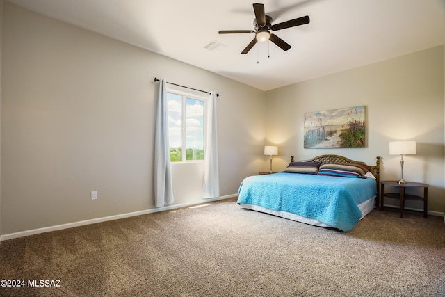 bedroom featuring carpet floors, baseboards, a ceiling fan, and visible vents